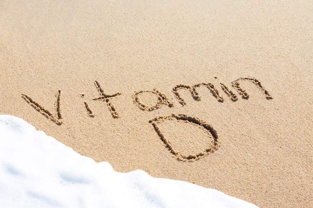  la vitamina d escribiendo en la arena